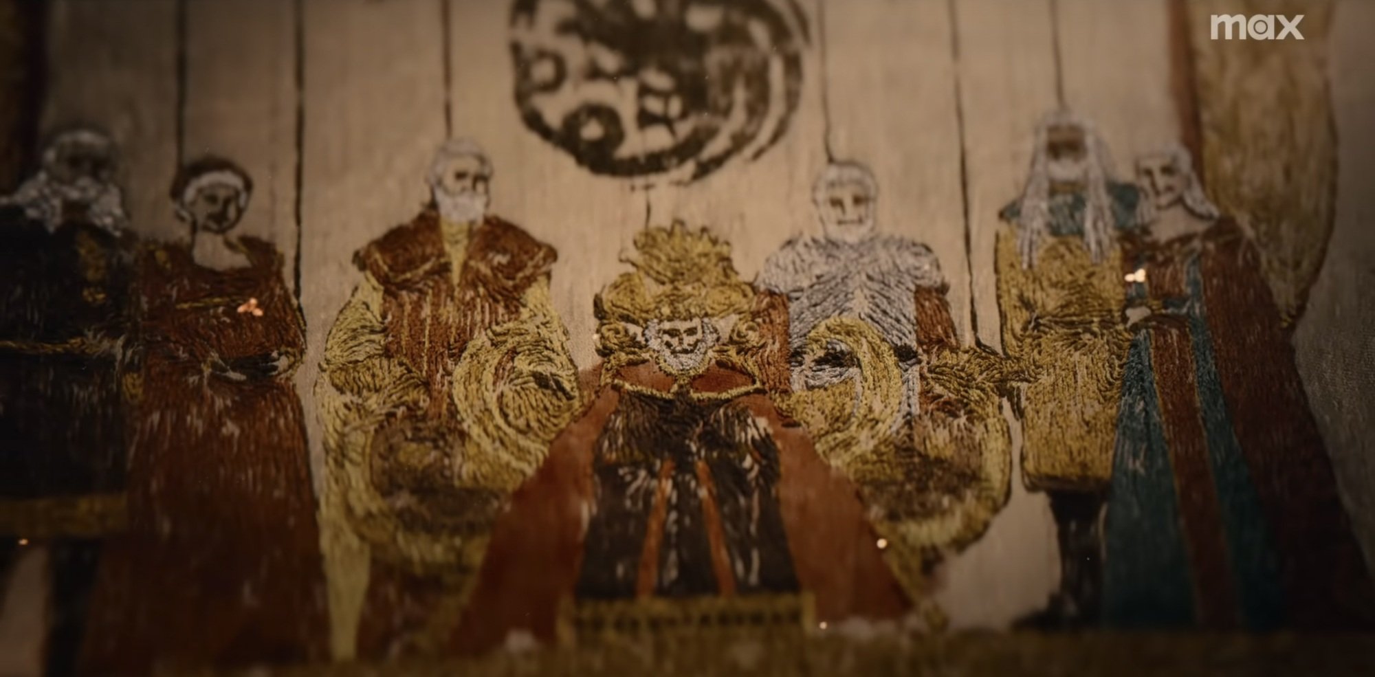 A tapestry of a group of Targaryens flanking a man on a throne with a dragon sigil above him.