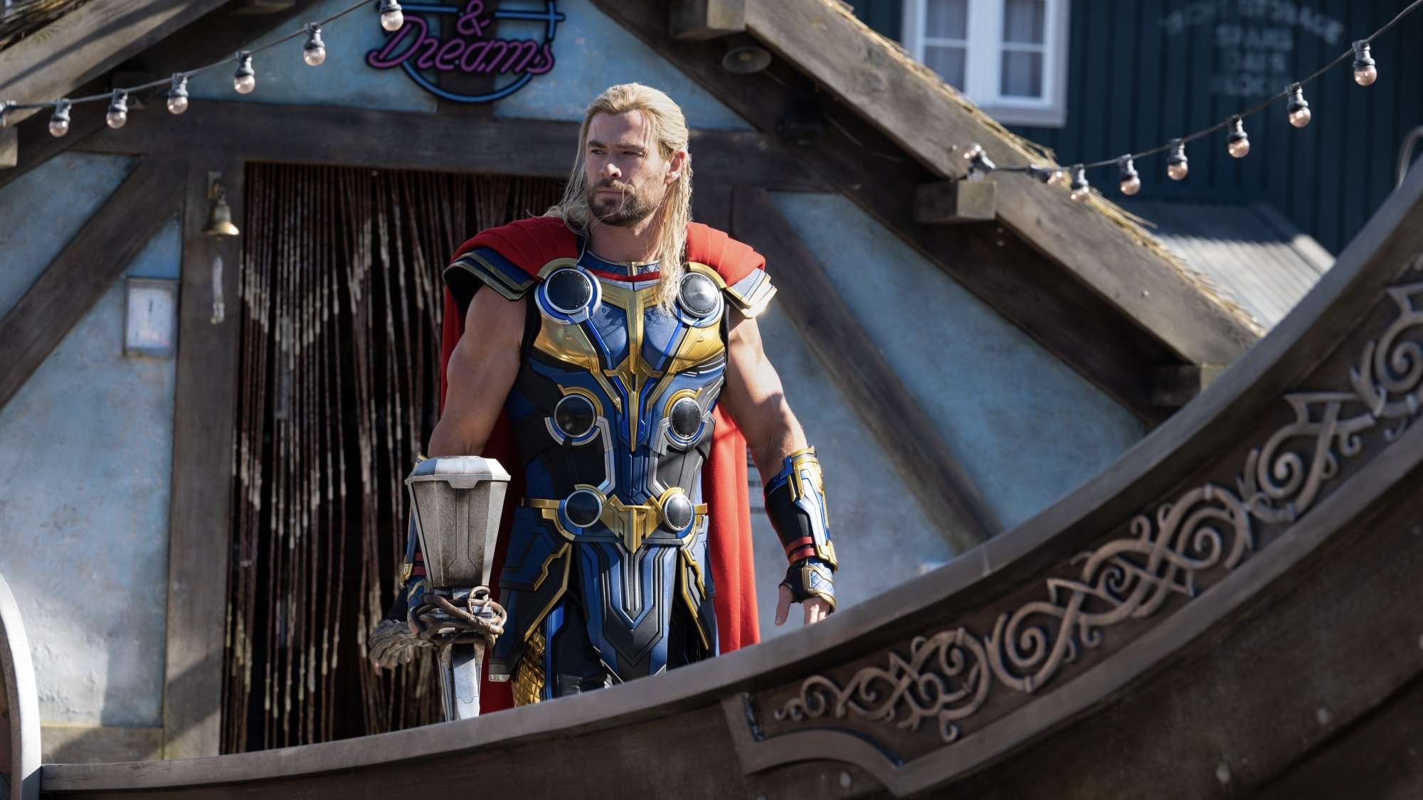 Thor stands on the deck of a ship.