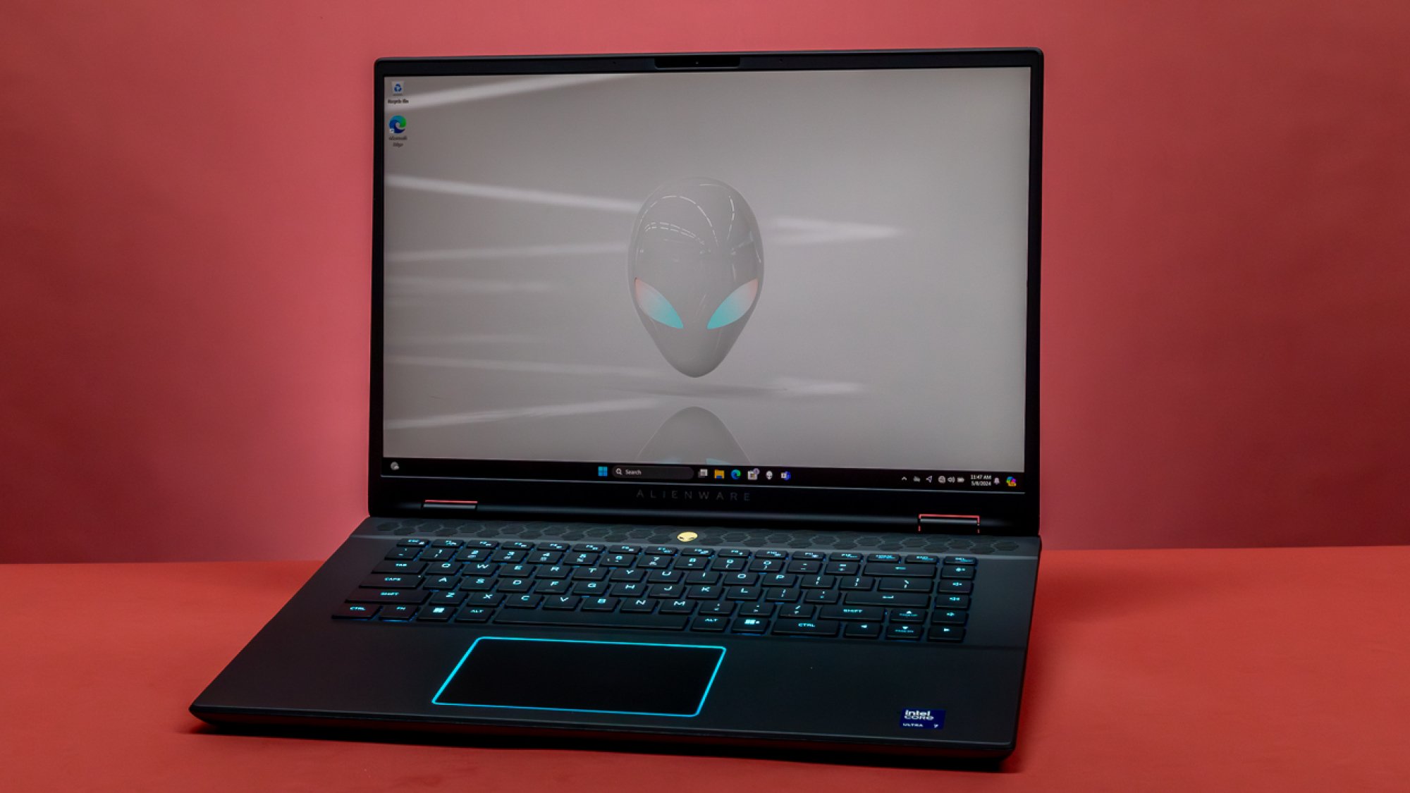 Alienware m16 r2 in front of red background