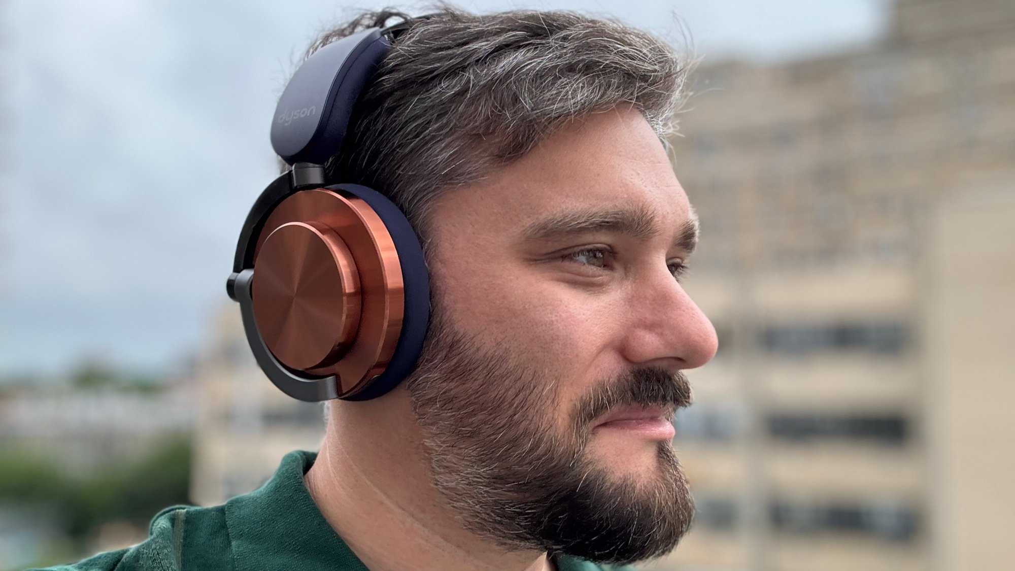 man wearing dyson ontrac headphones