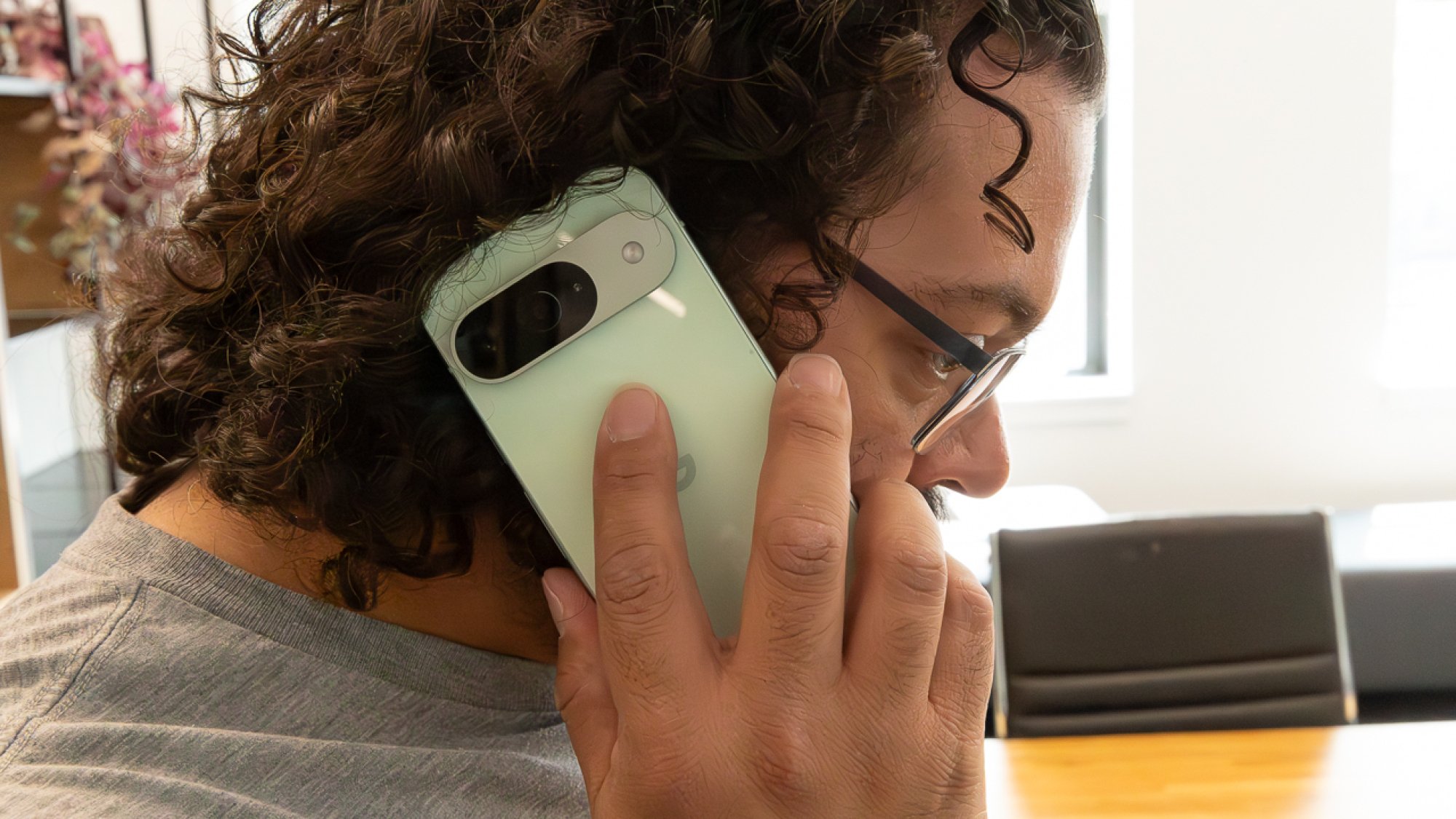 Google Pixel 9 man holding it to his ear