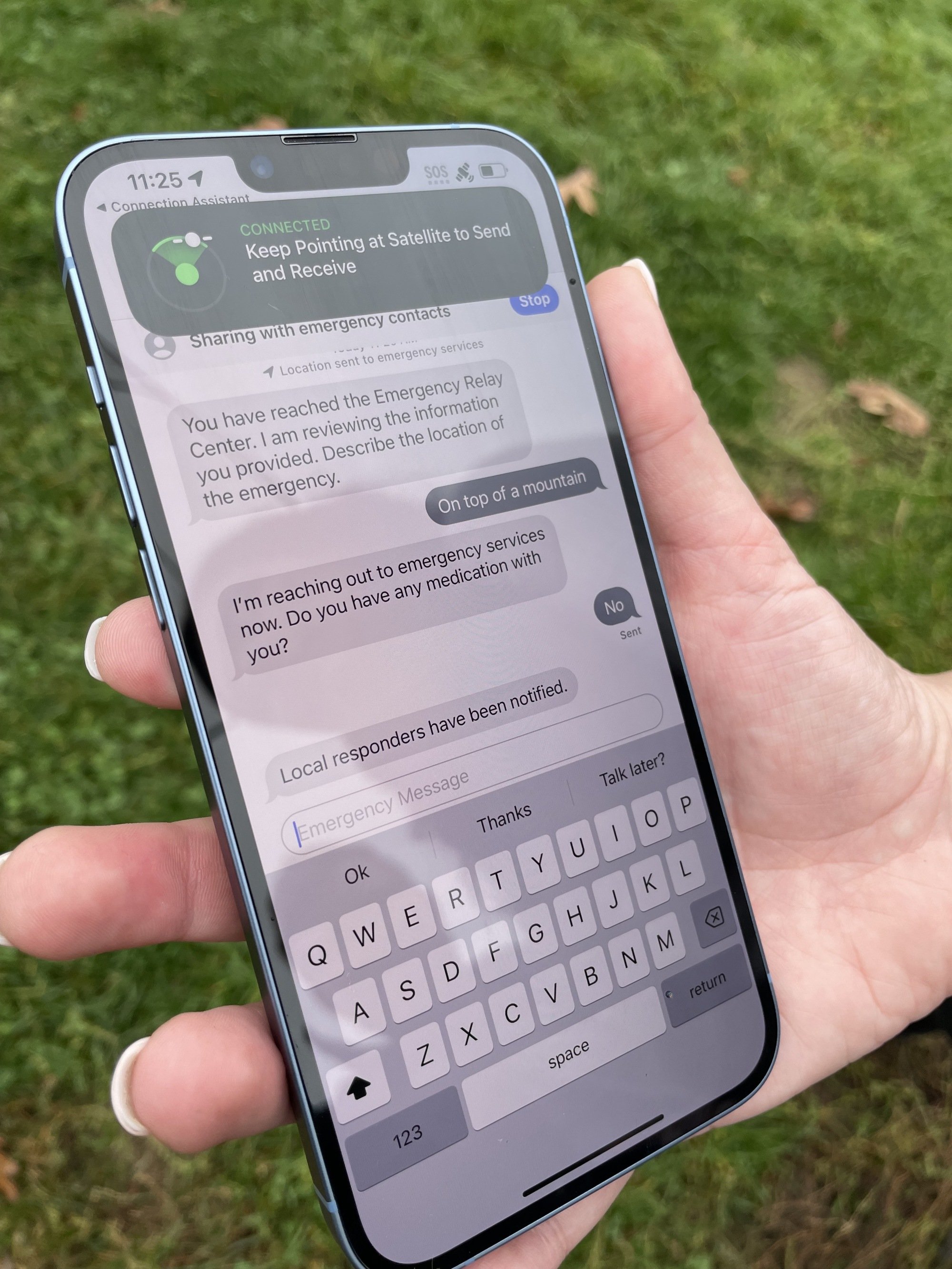emergency sos via satellite showing emergency services chat on iPhone 14