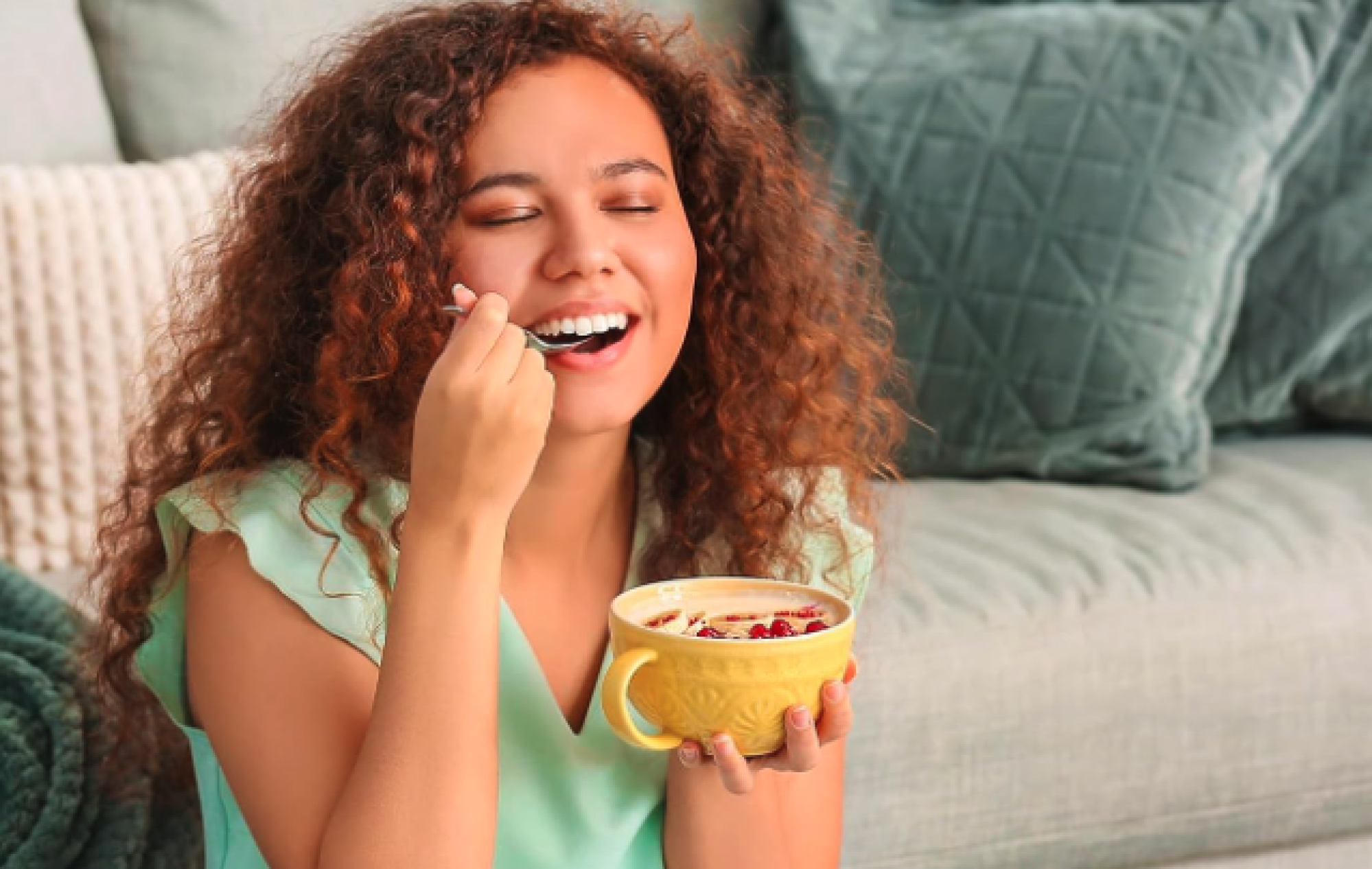 woman eating out of a bowl