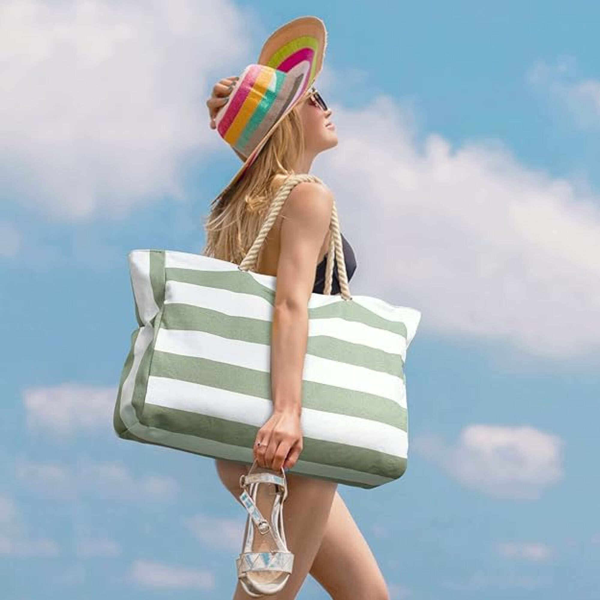 woman holding beach bag