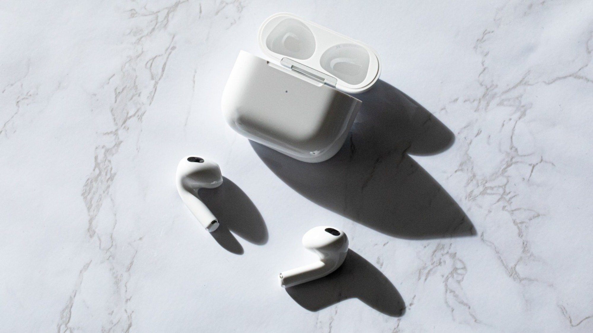 Apple AirPods model with marble table