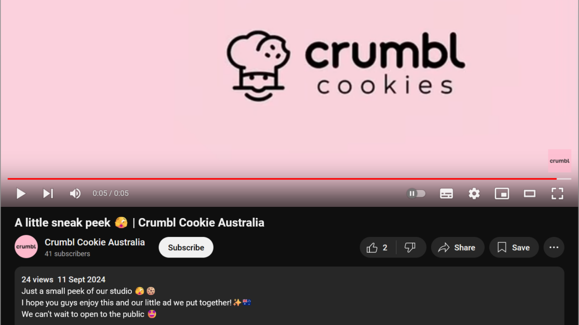 A screenshot of a video from @CrumblCookieAus on YouTube, showing the Crumbl Cookie logo. The description reads, ""Just a small peek of our studio."