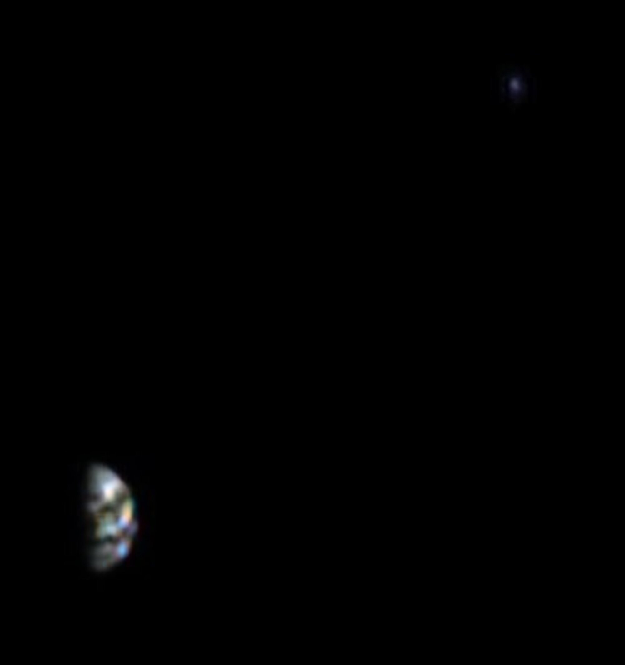 Earth (bottom left) and the moon (upper right) as viewed by Hera's HyperScout H instrument.