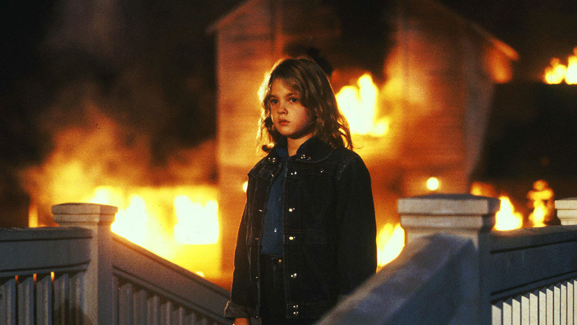 A young girl surrounded by fire.