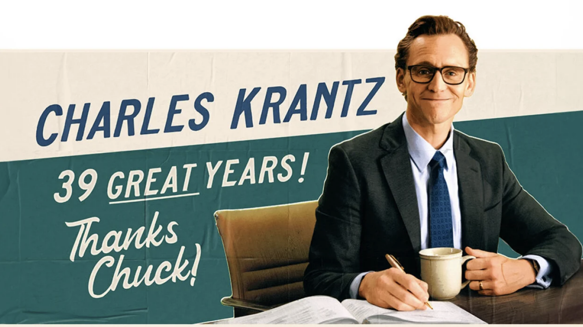 An advertising billboard shows an image of a man in a suit called Charles Krantz. "39 Great Years! Thanks Chuck!" It reads.